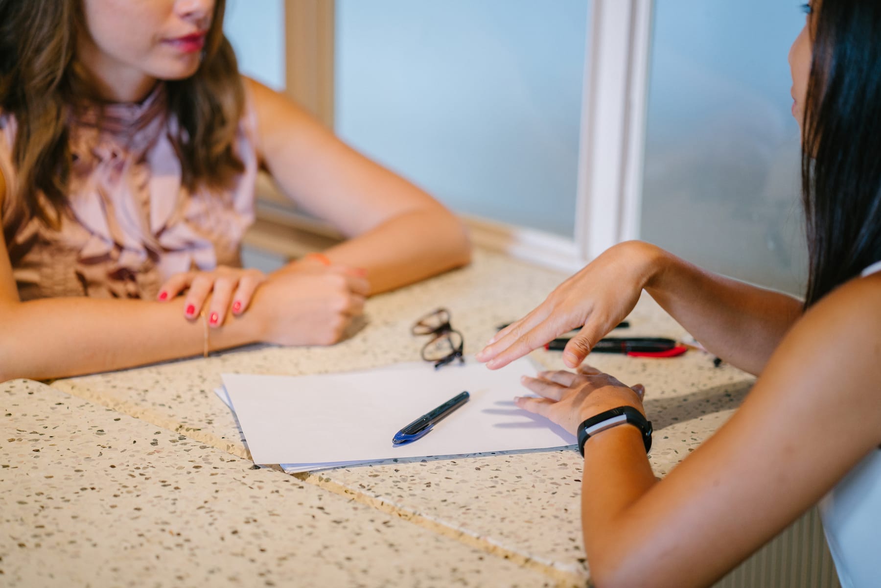 Canva - Two Woman Chatting