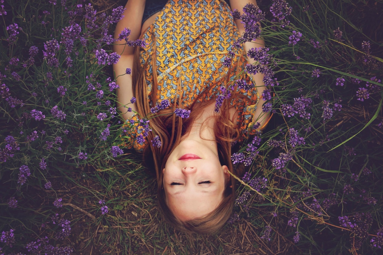 Canva - Woman Lying on a Lavender Field