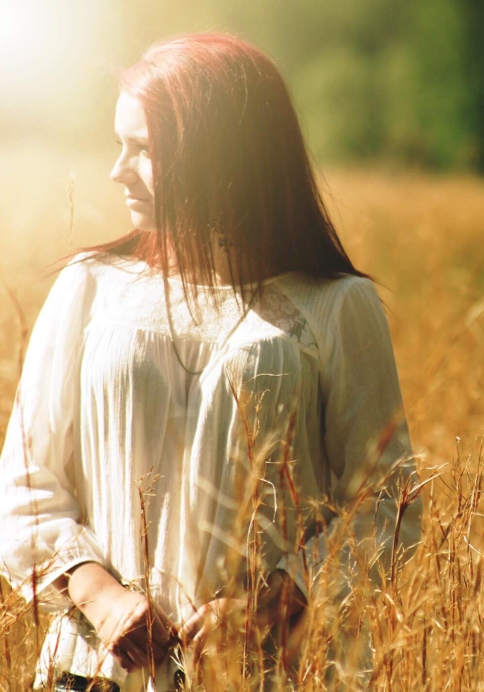 Canva - Woman Wearing White Long Sleeved Shirt Standing in Brown Grass Field